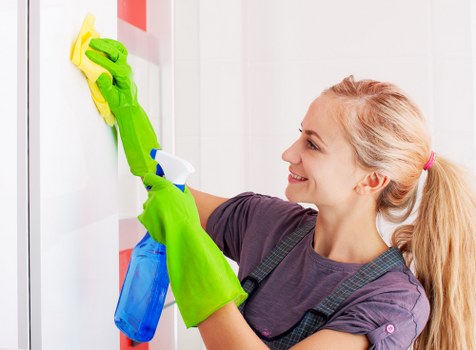 Carpet cleaner preparing equipment safely before a cleaning job