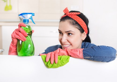 Cleaner restoring a fabric sofa in Shoreditch
